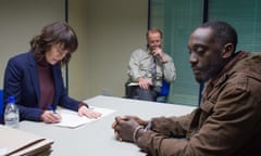 Immigration officers Lena Headey and Iain Glen interview Ivanno Jeremiah’s refugee in The Flood.