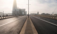 Quiet, empty and deserted roads on London Bridge, with no traffic commuting during rush hour commute