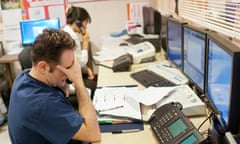 Stressed doctor talks on telephone.