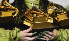 Billie Eilish poses in the press room with the awards for best album and best pop vocal album for “We All Fall Asleep, Where Do We Go?”, best song and record for “Bad Guy” and best new artist at the 62nd annual Grammy Awards at the Staples Center on Sunday, Jan. 26, 2020, in Los Angeles. (AP Photo/Chris Pizzello)