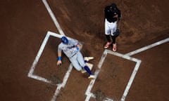 The Rangers' Josh Jung, left, scores on a wild pitch by the Diamondbacks relief pitcher Miguel Castro, right, during the second inning of Game 4.