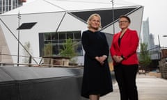 The chief executive of Aviva, Amanda Blanc (left), with the leader of Manchester city council, Bev Craig, outside the newly named Aviva Studios