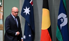 Australian Opposition Leader Peter Dutton walks past the Australian flag, the Indigenous flag and the flag of the Torres Strait Islands during Question Time in the House of Representatives at Parliament House in Canberra, Tuesday, August 1, 2023. (AAP Image/Lukas Coch) NO ARCHIVING