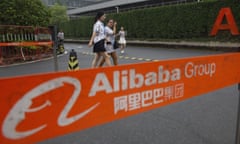 Workers pass by a checkpoint into the Alibaba Group headquarters in Hangzhou in eastern China’s Zhejiang province on Friday, May 27, 2016. Chinese regulators on Thursday, Dec. 24, 2020 announced an anti-monopoly investigation of e-commerce giant Alibaba Group, stepping up official efforts to tighten control over China’s fast-growing tech industries. (AP Photo/Ng Han Guan)