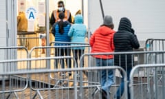 People arrive at a Covid-19 vaccination centre at Elland Road in Leeds.