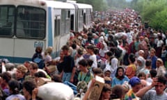 Refugees fleeing Bosnian Serb troops gather at Tuzla airport, eastern Bosnia, in July 1995.