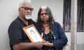 Helen and Ted Russell with a photo of their son Edward Russell who died in custody. 