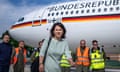 Annalena Baerbock walks through the airport of the airbase after her arrival from New York, in Bonn, Germany.