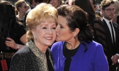 Debbie Reynolds, Carrie Fisher<br>FILE - In this Sept. 10, 2011 file photo, Carrie Fisher kisses her mother, Debbie Reynolds, as they arrive at the Primetime Creative Arts Emmy Awards in Los Angeles. On Friday, Dec. 30, 2016, Reynolds’ son, Todd Fisher, says his mother and sister will have a joint funeral and will be buried together at Forest Lawn Memorial Park cemetery in Los Angeles. (AP Photo/Chris Pizzello, File)