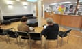 Patients sitting in the waiting room at a GP practice.