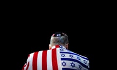 A member of the audience looks on wearing a United States-Israel themed custom suit during the AIPAC convention at the Washington Convention Center in Washington, U.S., March 2, 2020. REUTERS/Tom Brenner TPX IMAGES OF THE DAY