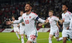 Aaron Ramsey celebrates after scoring Wales's opener from the penalty spot against Latvia.