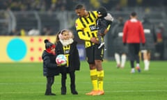 Sebastien Haller celeb rates with his family on the pitch after his first game since being diagnosed with testicular cancer. 