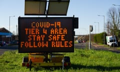 A roadside sign in Slough, on Christmas Eve last year, warning motorists that they are entering a Covid-19 Tier 4 area.