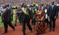 Zimbabwean President Emmerson Mnangagwa (C, front) and his wife Auxillia (R, front) attend a celebration marking the nation’s 38th independence anniversary