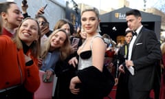 Florence Pugh with fans as she arrives at the Baftas.
