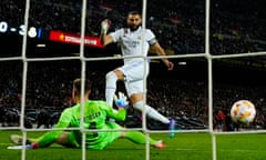 Karin Benzema (right) slots the ball past Barcelona's goalkeeper Ter Stegen to score Real Madrid’s fourth goal and his hat-trick.