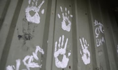 Handprints on a steel fence