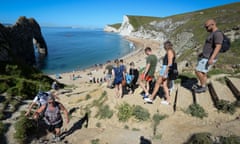 Tourists descend to Durdle Door near Lulworth in Dorset.