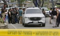 Police at the scene where César Suárez was shot dead on Wednesday.