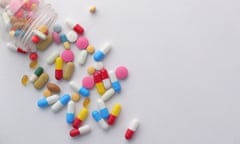 Pills scattered on a desk