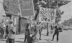 People hold banners to demonstrate against apartheid outside Lord's cricket ground in London  in 1965.