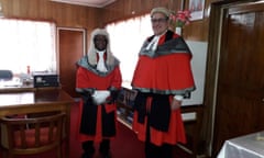 Justice David Lambourne and Sir John Baptist Muri, in ceremonial red gowns and white wigs