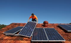 Solar system installer Bywater adjusts new solar panels on the roof of a house in Sydney<br>Solar system installer Thomas Bywater adjusts new solar panels on the roof of a house in Sydney August 19, 2009. REUTERS/Tim Wimborne (AUSTRALIA ENVIRONMENT ENERGY) - RTR26V9U ozstock