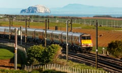 The East Coast rail service, seen here near Dunbar with the Bass Rock and Fife in the distance