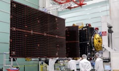 Technicians look at a solar panels on an Inmarsat satellite.