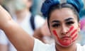 Protesters march in Denver<br>A woman with a red hand painted on her face, which calls attention to the high rates of indigenous women who are murdered or missing, raises a sign in solidarity with the Black Lives Matter M-movement at a protest against racial inequality in the aftermath of the death in Minneapolis police custody of George Floyd, in Denver, Colorado, U.S., June 3, 2020. Picture taken June 3, 2020. REUTERS/Kevin Mohatt TPX IMAGES OF THE DAY