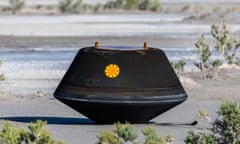 In this photo provided by NASA, the sample return capsule from NASA's Osiris-Rex mission lies on the ground shortly after touching down in the desert, at the Department of Defense's Utah Test and Training Range on Sunday, Sept. 24, 2023. The sample was collected from the asteroid Bennu in October 2020. (Keegan Barber/NASA via AP)