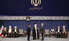 Iran’s supreme leader, Ayatollah Ali Khamenei delivers the official endorsement letter to president-elect Masoud Pezeshikan