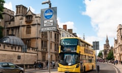A new yellow doubledecker drives along Oxford High Street