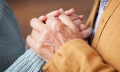 Close up of older couple holding hands