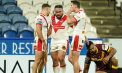 Konrad Hurrell celebrates scoring for St Helens with Tommy Makinson (left) and Jack Welsby.