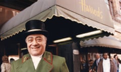 Mohamed Al Fayed standing outside Harrods wearing a doorman's uniform