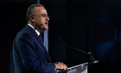 a man speaks from behind a lectern