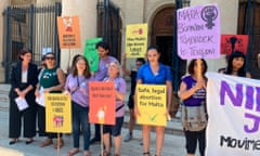Activists hold up banners in English and Maltese reading ‘I decide’, ‘Abortion is a woman’s right’, and ‘Abortion is healthcare, not a crime’ outside the country’s courts in Valletta.