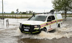 An SES vehicle drives through flood water in Tinamba in eastern Victoria in October 2023