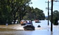 SES volunteers and police deliver food, medicine and other essentials to flooded properties around Windsor on Wednesday