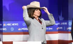 Woman makes a comedic face while holding a cowboy hat to her head against a fake 'NBC news' display