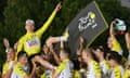 Tadej Pogacar is tossed up in the air by UAE Team Emirates teammates and staff after his Tour de France triumph