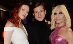 Daniel Lee poses with Karen Elson, left, and Donatella Versace at the British Fashion Awards