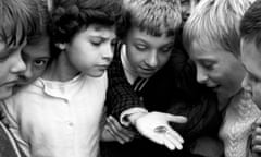 Children looking at the new 50 pence coin in 1969. 