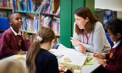 A tutor, Tamzin, with children at Thameside primary school, Abingdon, Oxford