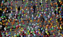 People walk under many-colored baloons decorating a street during celebrations of the Tbilisoba City Day in Tbilisi, Georgia, Saturday, Oct. 15, 2016. Tbilisoba is an annual October festival, celebrating the diversity and history of Tbilisi, the capital of Georgia. (AP Photo/ Shakh Aivazov)