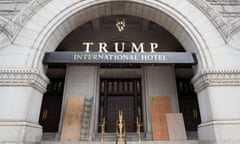 Plywood covers graffiti at an entrance to the Trump International Hotel in Washington.