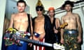 barechested, and winking, shrieking or gurning members of the Red Hot Chili Peppers band pose for a group portrait in 1984