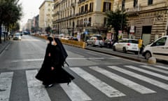 Passers-by near Piazza Bovio in Naples.